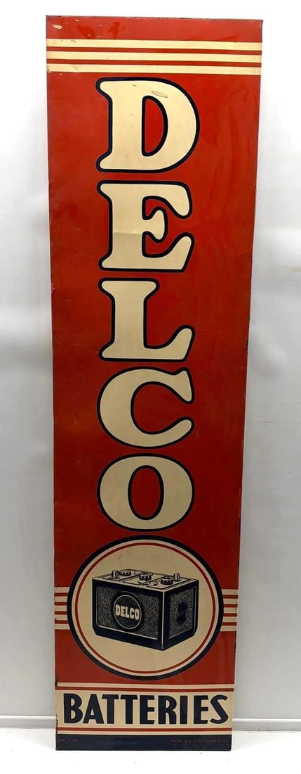 1946 Delco Batteries Sign w/ Battery: Delco Batteries single sided vertical sign with original wood frame back.? Marked "Made in USA",? "AM 2-46" and features Battery image.? Presents with good color and some wear.? Measures 19x71.