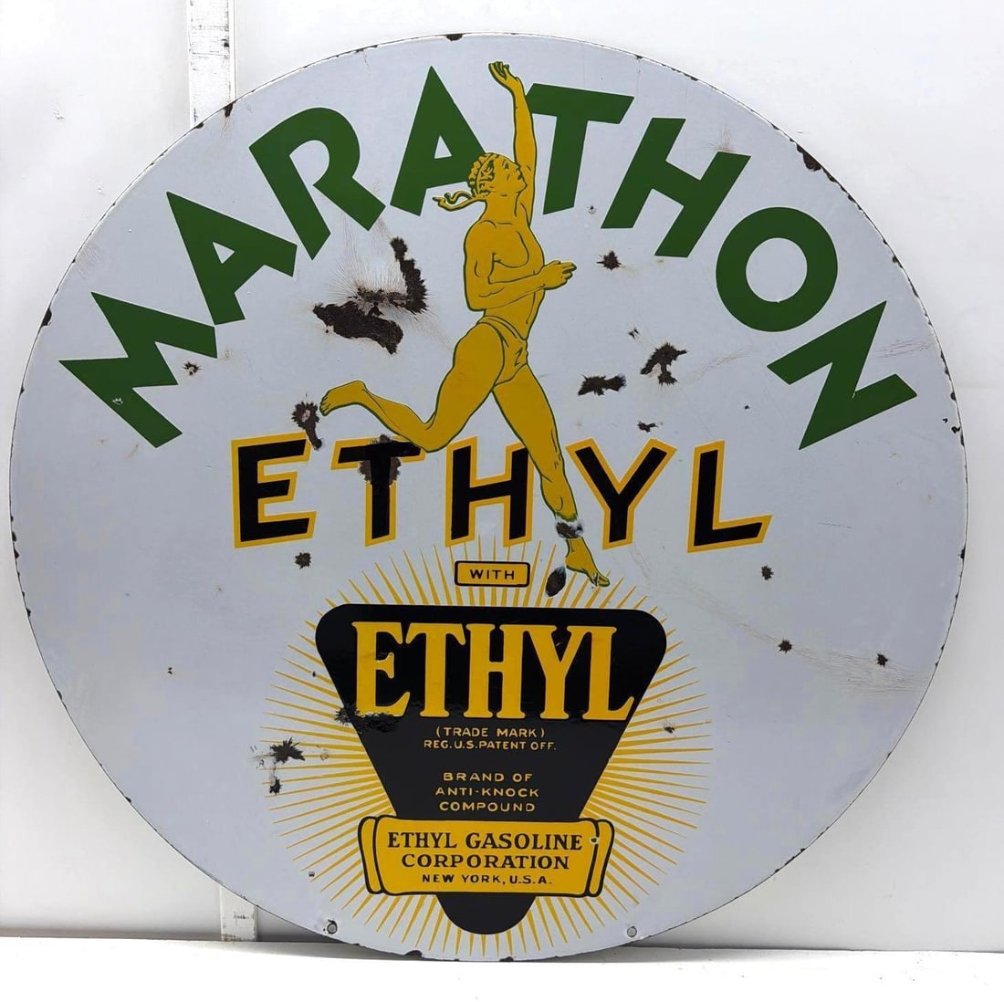 30" Marathon Ethyl Porcelain Sign w/ Runner: Marathon Ethyl double sided porcelain sign.? Features famous Marathon Runner and Ethyl trademark logo.? Presents with good color and chips.? Measures 30".