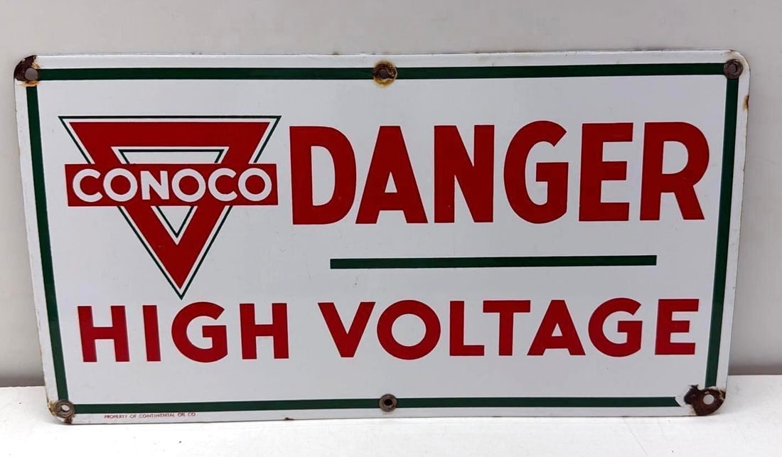 Conoco Danger High Voltage Porcelain Sign: Conoco Danger High Voltage single sided porcelain sign.? Marked Property of Continental Oil Company and features green outlined triangle logo.? Presents with strong color and minor edge wear.