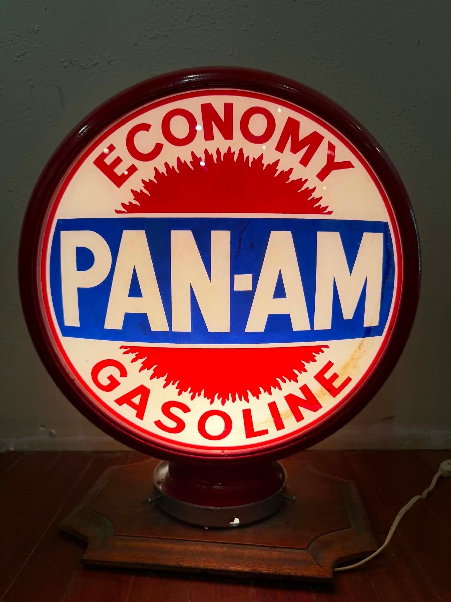 15" Pan-Am Gasoline Pump Globe: Pan-Am Quality Gasoline pump globe. Display side reads "Economy and is in very good condition. Side two reads "Quality" and presents well with some staining. Both mounted on a re-painted 15" metal bod