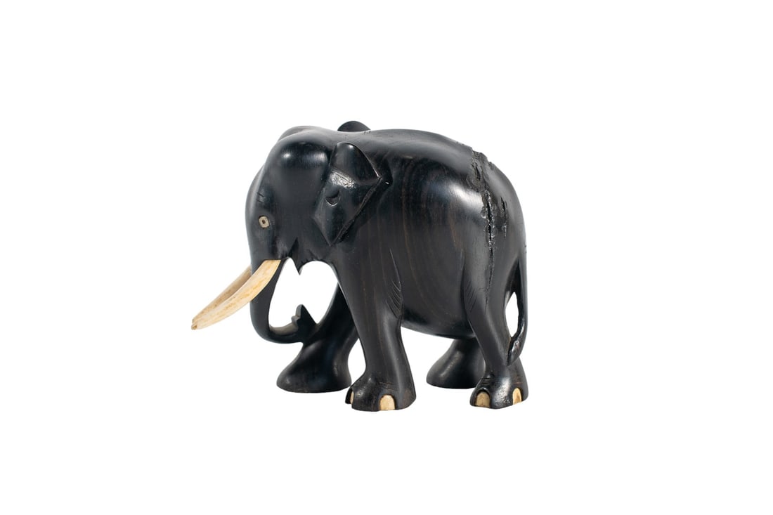 Antique Ebony Wood Black Elephant Sculpture Statue with Ivory Tusk - 1920c: Antique Ebony Wood Black Elephant Sculpture Statue with Ivory Style Tusk, a masterpiece that symbolizes strength and grace in every curve and line. Crafted from the finest ebony wood, this statue is n