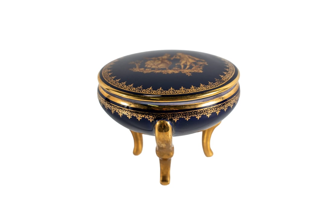 Limoges Three-Legged Round Cobalt Blue Enamel Gold Trim Trinket Case: Limoges French porcelain trinket case which features a three-legged design and vibrant cobalt blue & gold trim enamel color that will bring attractiveness. The objet d'art trinket case is perfect for 
