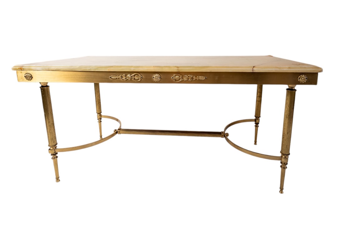 Antique Neoclassical Style Brass Coffee Table With White Onyx Marble Top - 1900c: This exquisite Antique Neoclassical Style Brass Coffee Table, dating to circa 1900, exudes timeless elegance. The white onyx marble top showcases natural veining, resting atop a beautifully detailed b