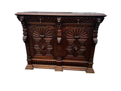 19th Century Flemish Carved Oak Wood Renaissance Cupboard Cabinet Buffet: This pure rich history of a 19th Century Flemish carved oak wood Renaissance cupboard cabinet buffet showcases exceptional craftsmanship and intricate detailing along with solid bronze handles. It
