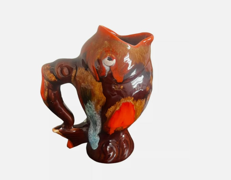 Mid Century French Art Ceramic Pottery Pitcher Fish Design Signed By Vallauris: This French art ceramic pottery pitcher is the perfect addition to your collection. With a unique fish design, this mid-century modern style jug is handmade and signed by Vallauris. The brown and oran