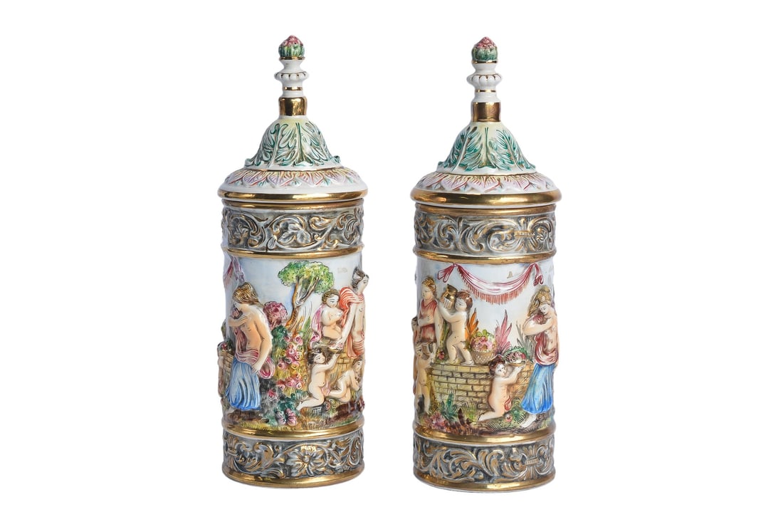 Original Antique 19th Century Italian Capodimonte Capo di Monte Cherub Angels Porcelain Hand Painted: This exquisite pair of Antique 19th Century Italian Capodimonte porcelain cylindrical pitcher vases with detailed handcrafted cherub and floral designs, crafted in Italy during the 19th Century, showc