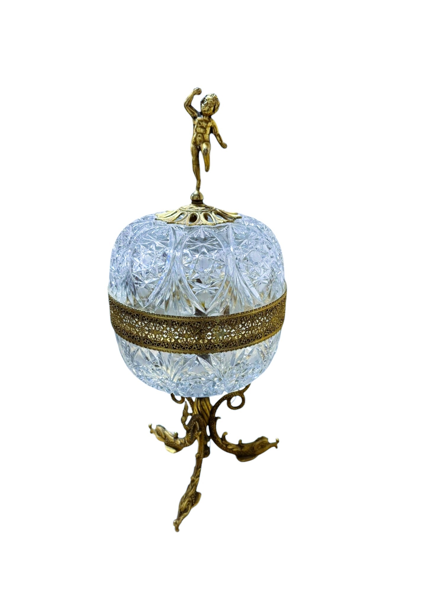 20th Century Italian Gilt Brass Diamond Cut Crystal with Brass Cherub Figurine & Koi Base: This elegant 20th Century Italian Gilt Brass Diamond Cut Crystal features a charming brass cherub figurine gracefully perched on a detailed koi fish base. The lamp is wired for 220v and will require c