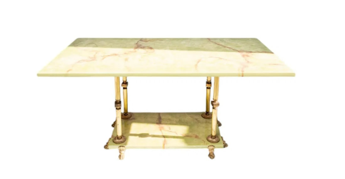 French Mid-Century Coffee or Cocktail Low Table of Brass With White Beige Onyx Marble Top: This French Mid-Century Coffee or Cocktail Low Table exudes timeless elegance with its polished brass frame and white-beige onyx marble top. The luxurious onyx surface, known for its unique veining, i