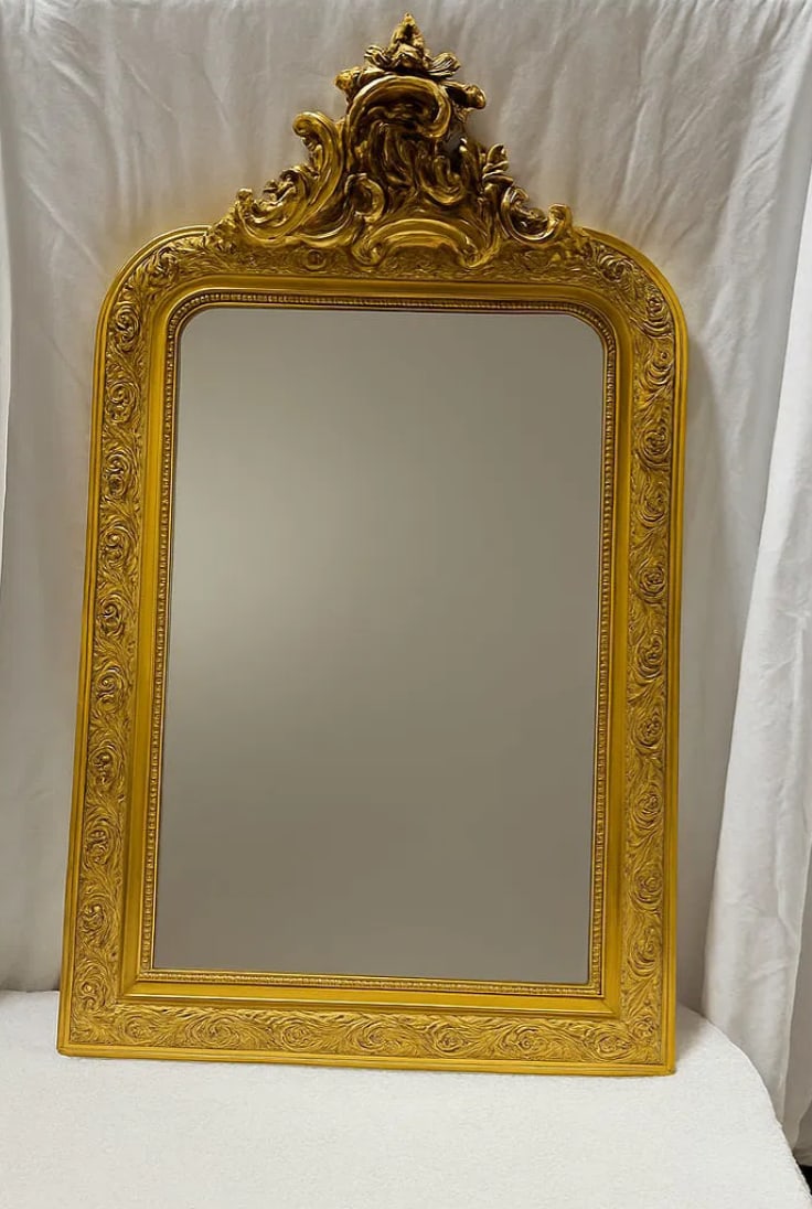 Large Late 19th Century Louis Philippe Carved Giltwood Mirror With Stucco Floral Motifs: This impressive Large Late 19th Century Louis Philippe giltwood mirror showcases a beautifully carved gilded frame embellished with finely detailed stucco floral motifs, reflecting the elegant craftsm