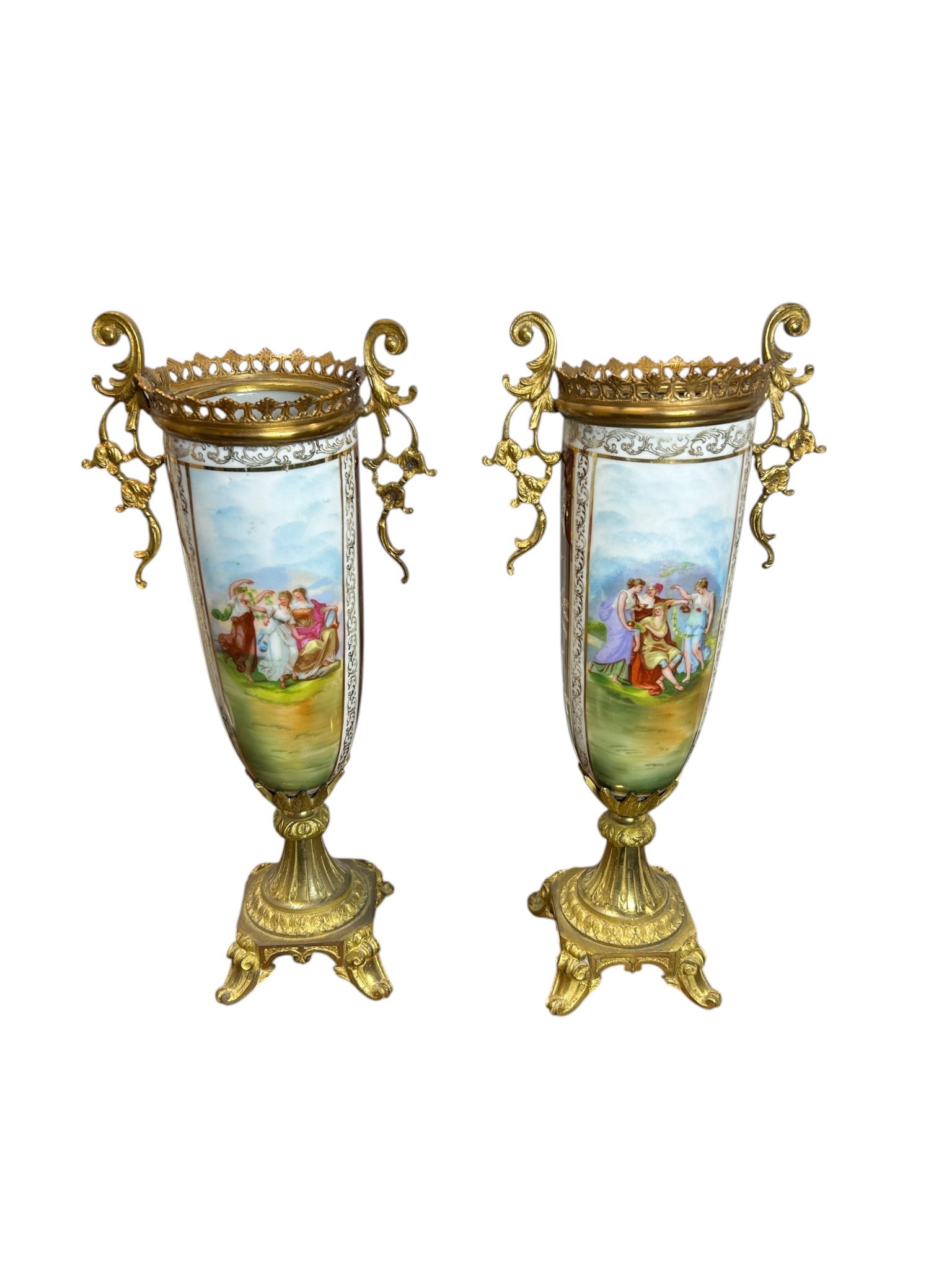 A Pair Of Sèvres Porcelain Vases, Late 19th Century, Napoleon III Style, with Gilt Bronze Mounts: An elegant pair of antique Sèvres porcelain vases crafted in the Napoleon III style, dating to the late 19th century. These refined urn-form vases feature beautifully hand-painted classical figural s