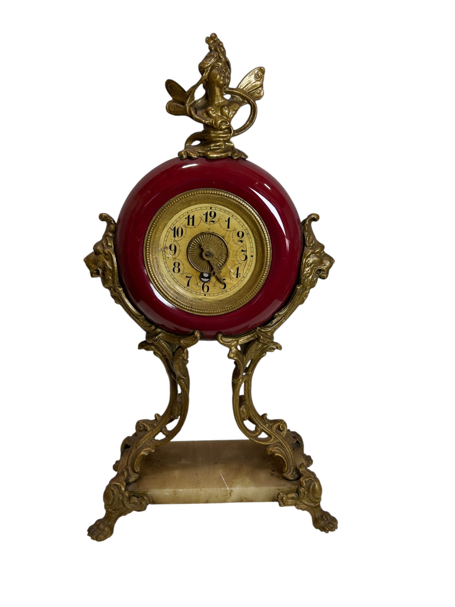 19th Century Antique Art Nouveau Rococo Red Enamel Mantel Clock with Bronze Figural Mounts: An elegant antique Art Nouveau mantel clock featuring a striking red painted glass circular body accented with ornate bronze figural mounts and a decorative onyx marble base. This highly decorative ti
