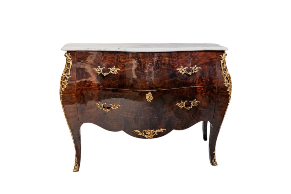 Early 20th Century Louis XV Style Gilt Bronze Ormolu Inlaid Marquetry Commode Bombay Dresser with: This Early 20th Century Louis XV Style Gilt Bronze Ormolu Inlaid Marquetry Commode Bombay Dresser is an exquisite statement piece showcasing superb craftsmanship. Featuring a curvaceous Bombay silhoue