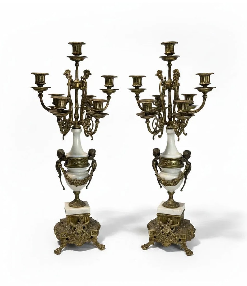 Pair of 19th Century Antique French Cherub Louis XVI Bronze & White Marble 5-Arm Candelabras: An exceptional pair of 19th Century antique French Louis XVI style candelabras featuring ornate gilt bronze construction combined with elegant white marble elements and charming cherub motifs. These h