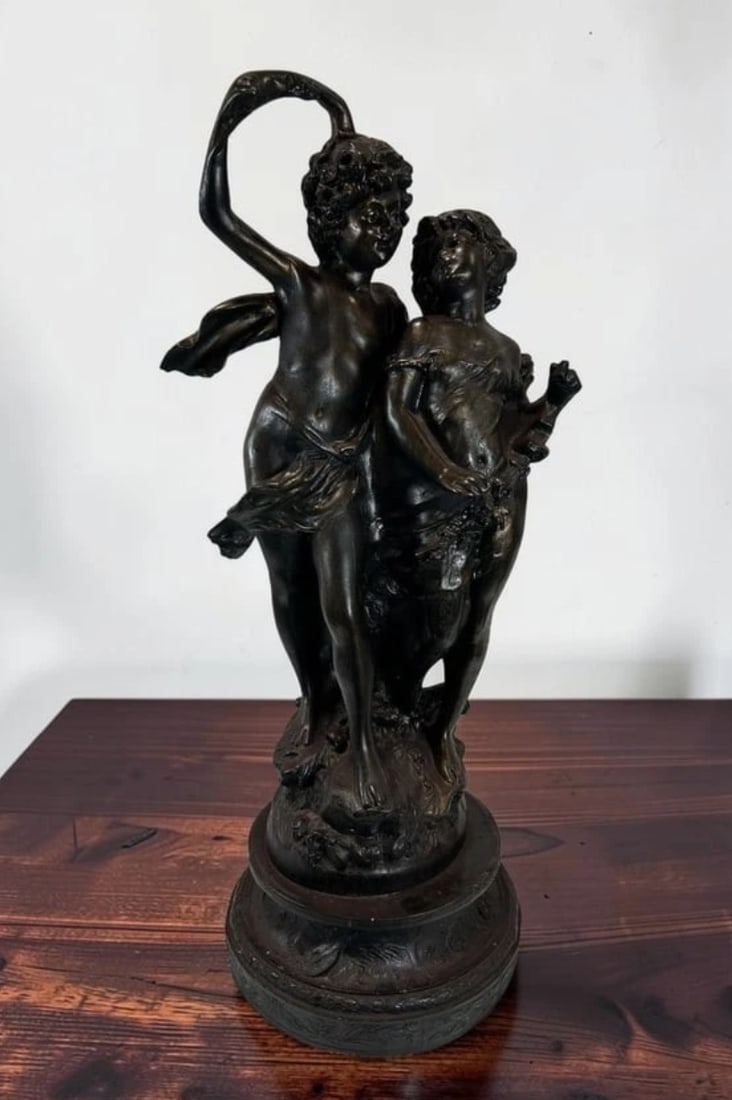 Antique French Clodion Style Spelter Bronze Putti Cherub Sculpture 23": This impressive Large Antique French Spelter Bronze Putti Cherub Sculpture beautifully captures the playful elegance and romantic spirit associated with the celebrated works of Clodion (Claude Michel,