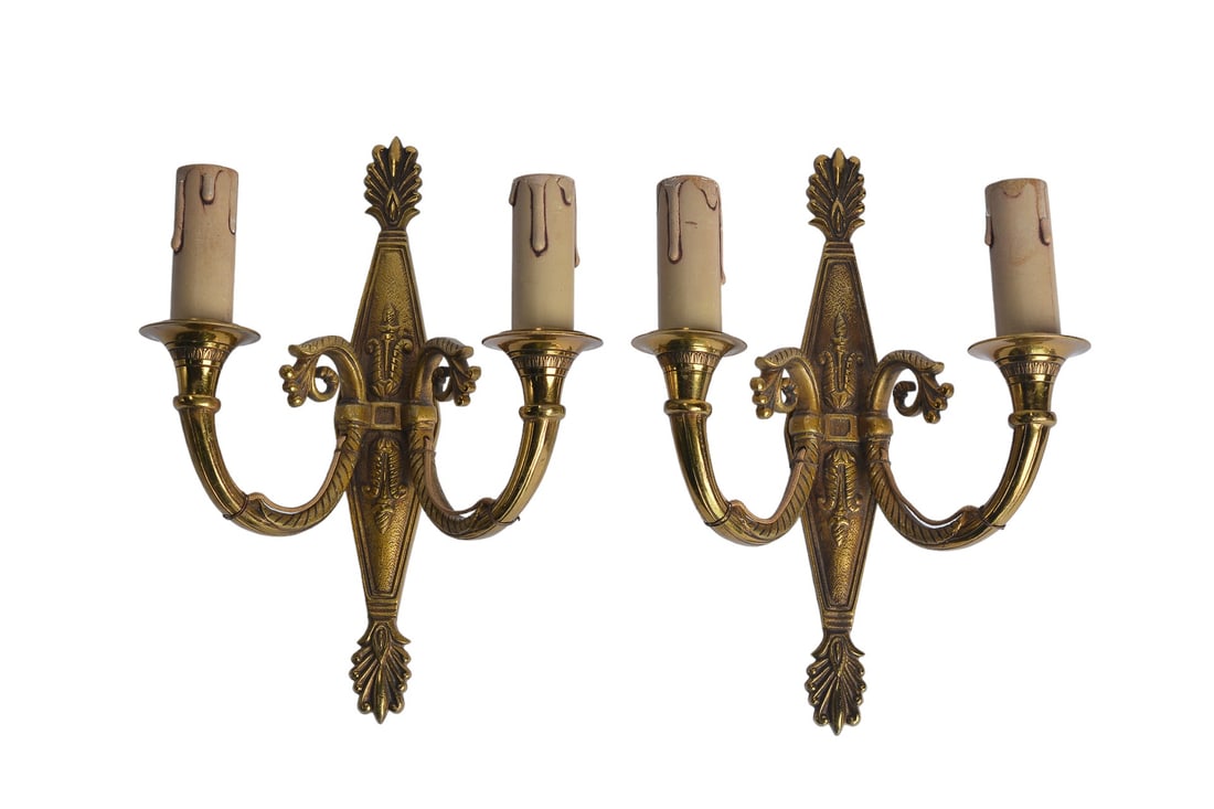 Antique French Empire Neoclassical Pair Of Gilded Antique Brass Wall Lights: Illuminate your space with the timeless elegance of our Neoclassical French Pair Of Gilded Antique Brass Wall Lights. Crafted with exquisite attention to detail, these wall lights exude sophistication