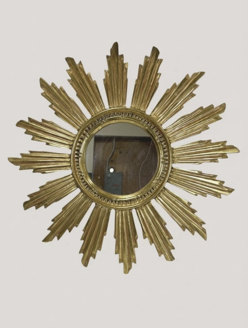 Mid Century 1960s Convex Giltwood Sunburst Starburst Mirror 20" Gilded Wood Wall: intage Gilded Wood Convex Sunburst Mirror (20" x 20")Up for sale is a gorgeous, authentic mid-century sunburst wall statement piece. Crafted during the peak of the 1960s Hollywood Regency movement, th