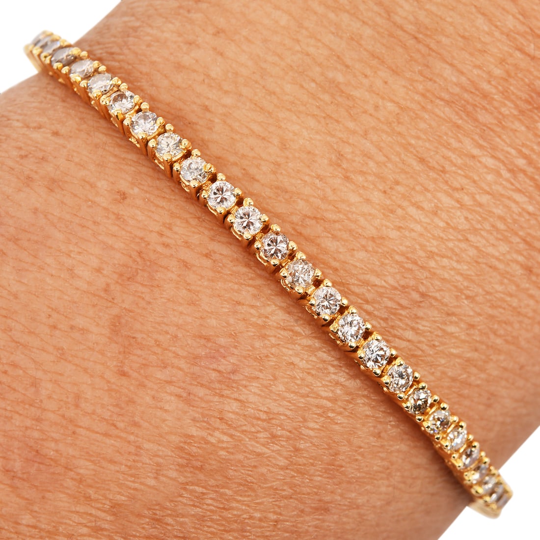 Estate 3.00ct Diamond 18K Yellow Gold Tennis Bracelet 8.1 Grams: Estate 3.00ct Diamond 18K Yellow Gold Tennis Bracelet – 8.1 Grams Product Description: This stunning Estate Diamond Tennis Bracelet is crafted from 18K yellow gol