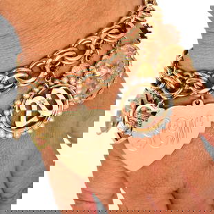 Vintage 14K Yellow Gold 12-Charm Bracelet 120 Grams: Vintage 14K Yellow Gold 12-Charm Bracelet with Jadeite, Ruby, Pearl & Diamond Accents Product Description: This spectacular **vintage charm bracelet** is crafted