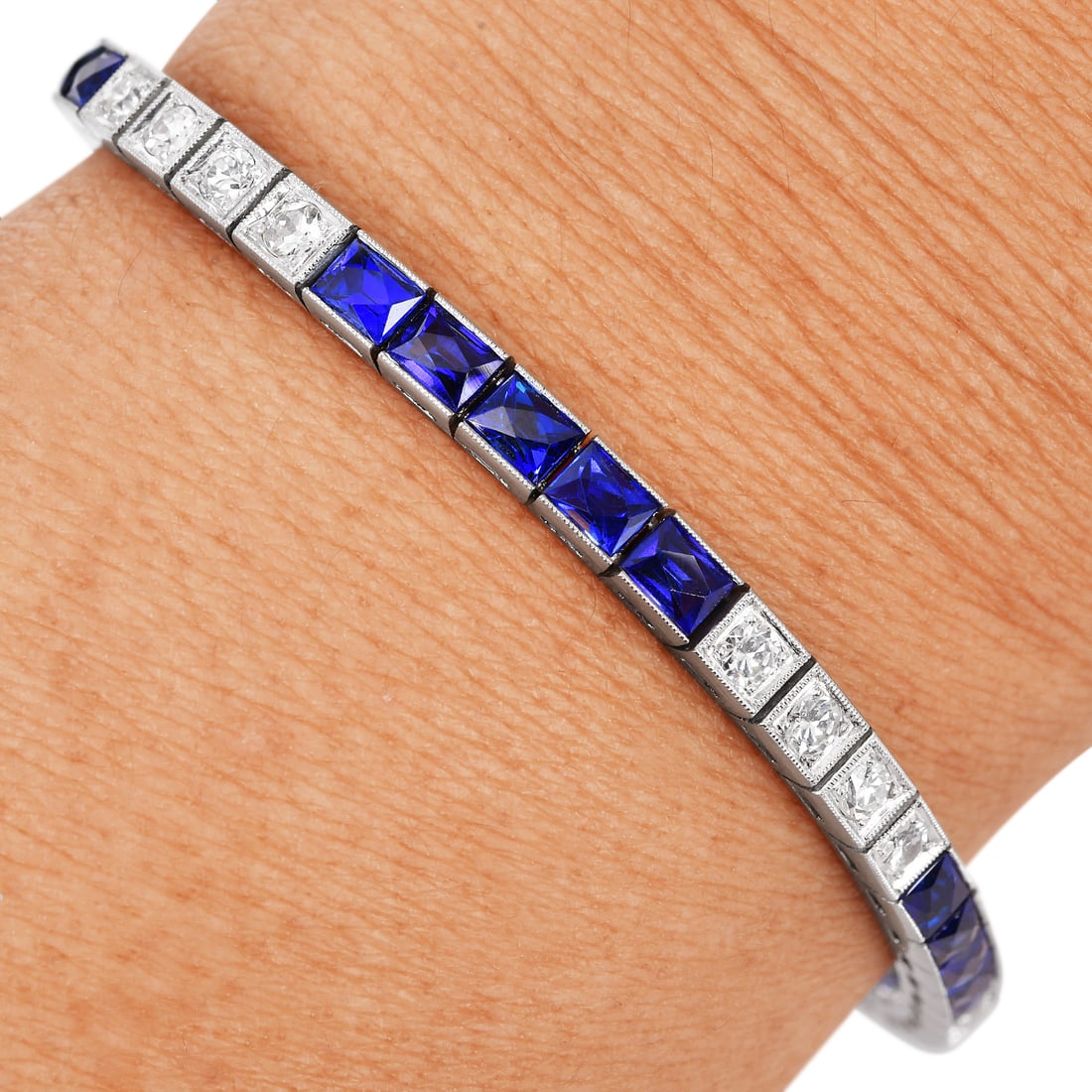 Deco Style 1.50ct Diamond Synthetic Sapphire Platinum Vintage Line Bracelet 20.3 Grams: Deco Style Diamond & Synthetic Sapphire Platinum Vintage Line Bracelet This elegant vintage line bracelet showcases classic Art Deco?inspired design, crafted in solid platinum and accented with s