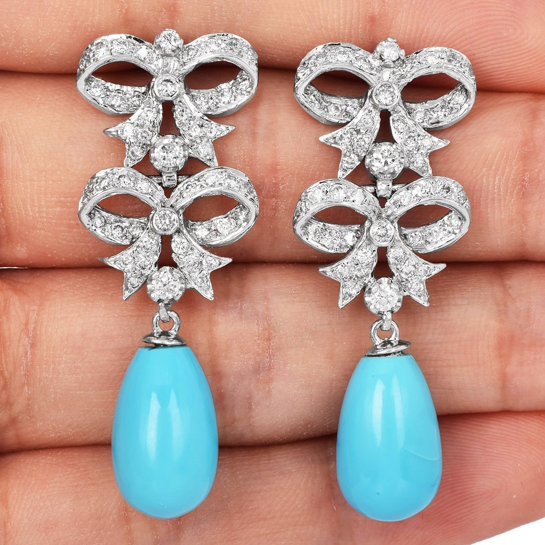 Estate Turquoise 0.70ct Diamond 18K White Gold Dangle Earrings 10.65 Grams: Turquoise, Diamond & 18K White Gold Bow Earrings Description: These elegant turquoise and diamond earrings are finely crafted in solid 18K white gold