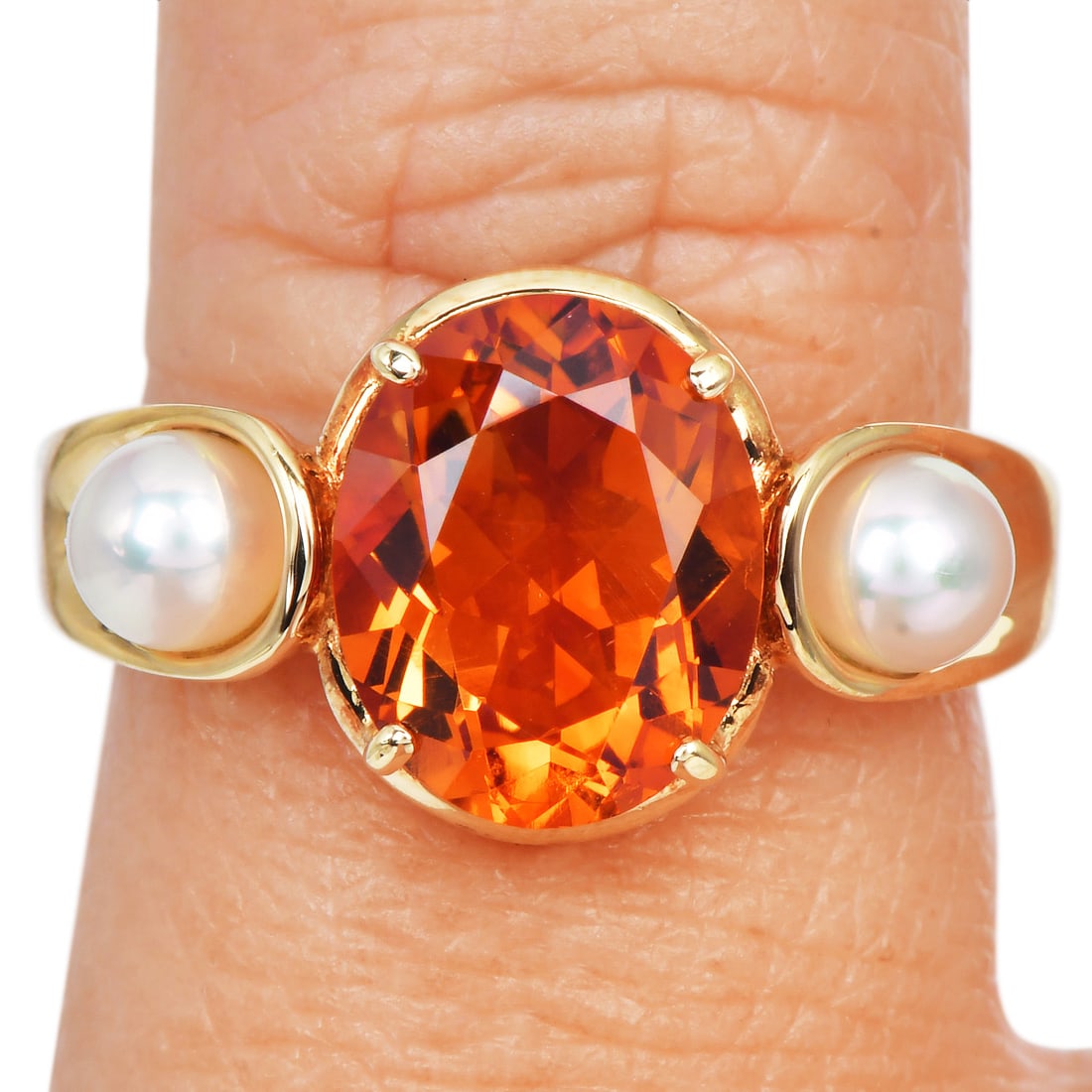 Mikimoto Pearl Citrine 18K Yellow Gold Ring 5.60 Grams: Item: Mikimoto Pearl & Citrine Ring Description:Ring by Mikimoto crafted in 18 karat yellow gold, featuring a central citrine weighing approximately 2.70 carats. The citrine is accented by two culture