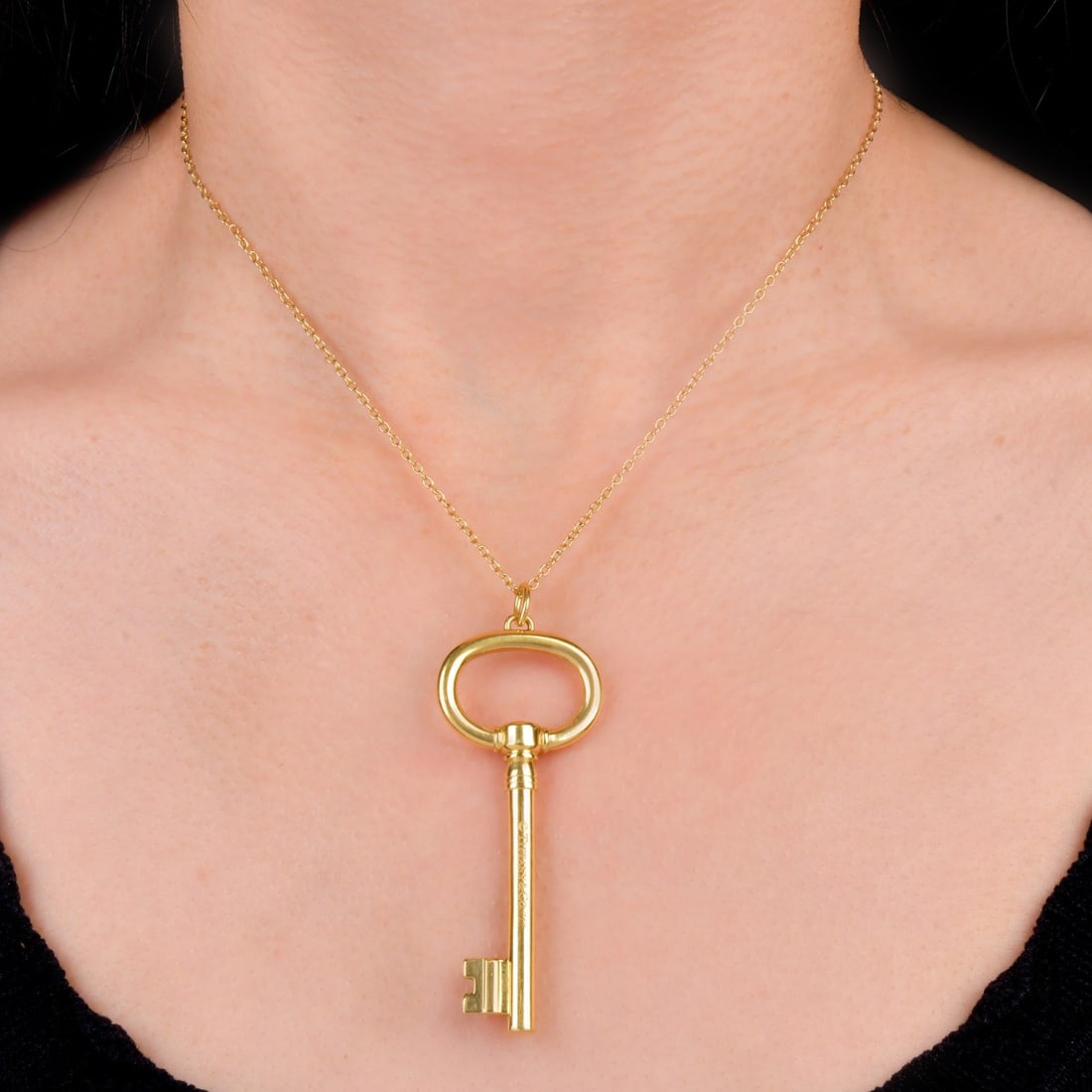 Tiffany & Co. 18K Yellow Gold Large Oval Key Pendant 18 Grams: From the Tiffany Keys Collection, this Tiffany & Co. Oval Key Pendant in 18K yellow gold is a minimalist oval design