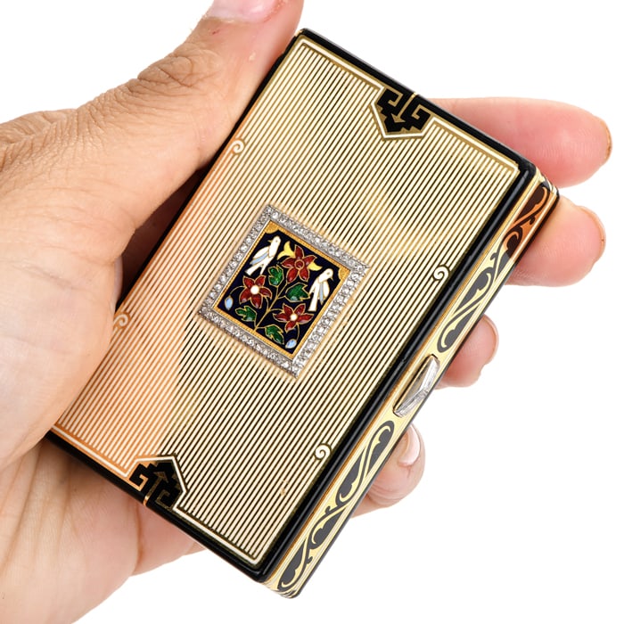 Cartier Vintage Diamond 18K Yellow Gold Enamel Compact Box Vanity Case 125.8 Grams: Art Deco Cartier Masterpiece Vanity Case Compact box. This vintage diamond 18K yellow gold compact box from the 1940s, features a topped bird on a branch design, with black enamel acce