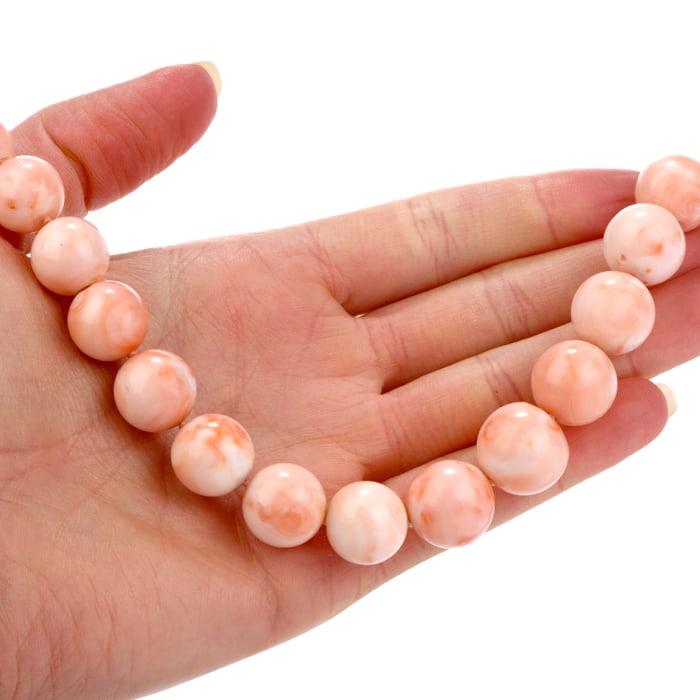 Vintage Natural Pink Coral 15 mm 14K Yellow Gold Graduated Bead Necklace 144.1 Grams: Indulge in this significant natural Coral 15 mm Graduated Necklace. Each large coral graduated bead ranges from 15-10 mm in width. The necklace spans 25 inches long around the neckline