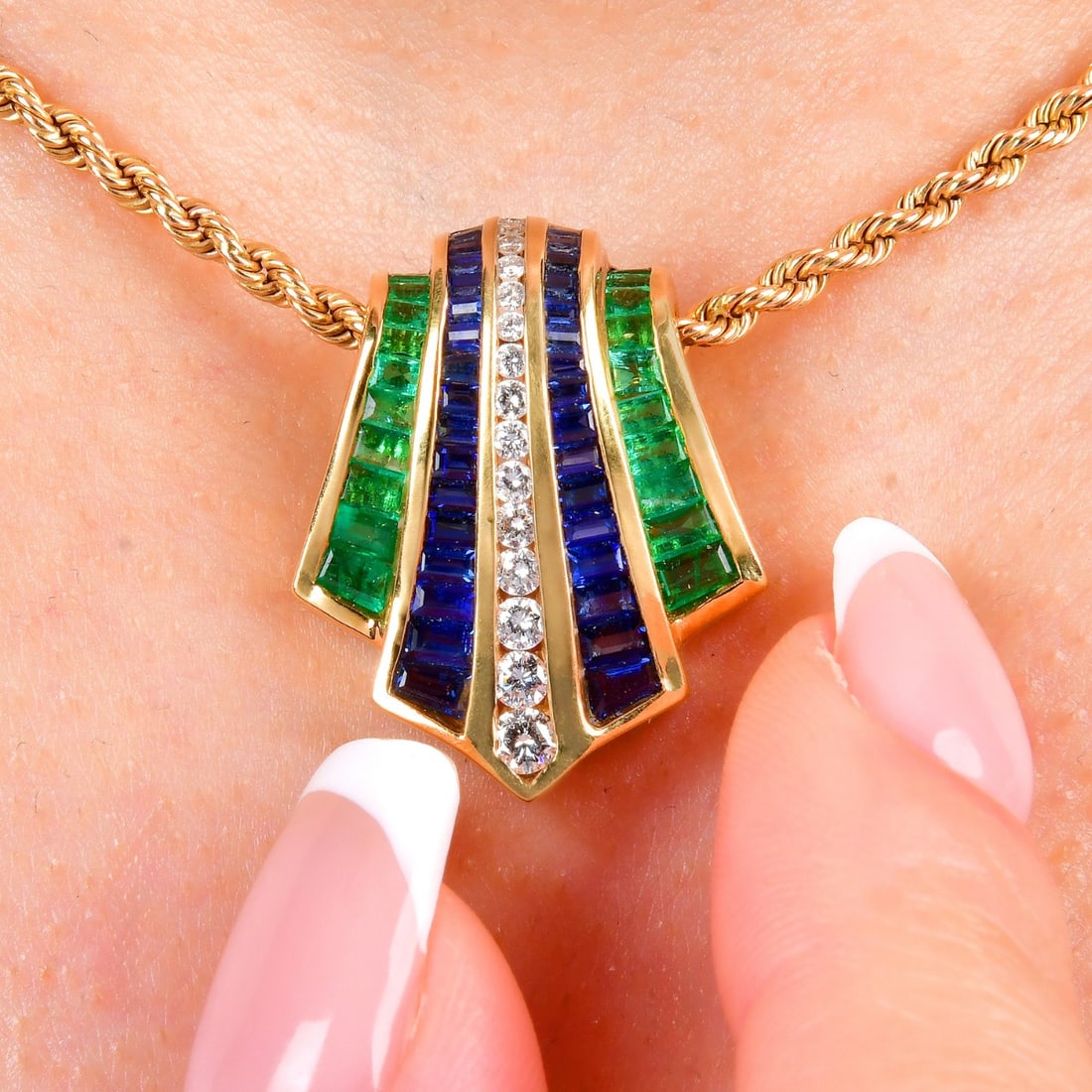 Charles Krypell Diamond 3.38ct Emerald Sapphire 18K Yellow Gold Pendant 8 Grams: A sculptural slider pendant by Charles Krypell, crafted in 18K yellow gold with precision channel set gemstones. This iconic design features vivid emeralds and sapphires flanking a central row of bril