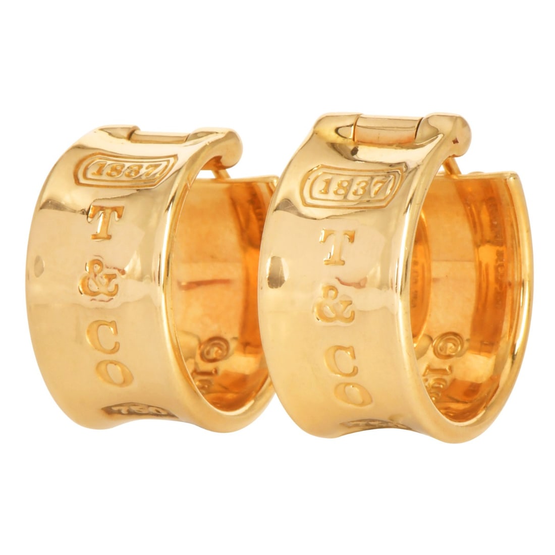 Tiffany & Co. 1837 Collection 18K Yellow Gold Hoop Earrings 13.7 Grams: These exquisite Tiffany & Co. 1837 hoop earrings embody the brand’s signature sophistication and refined craftsmanship. Sculpted in