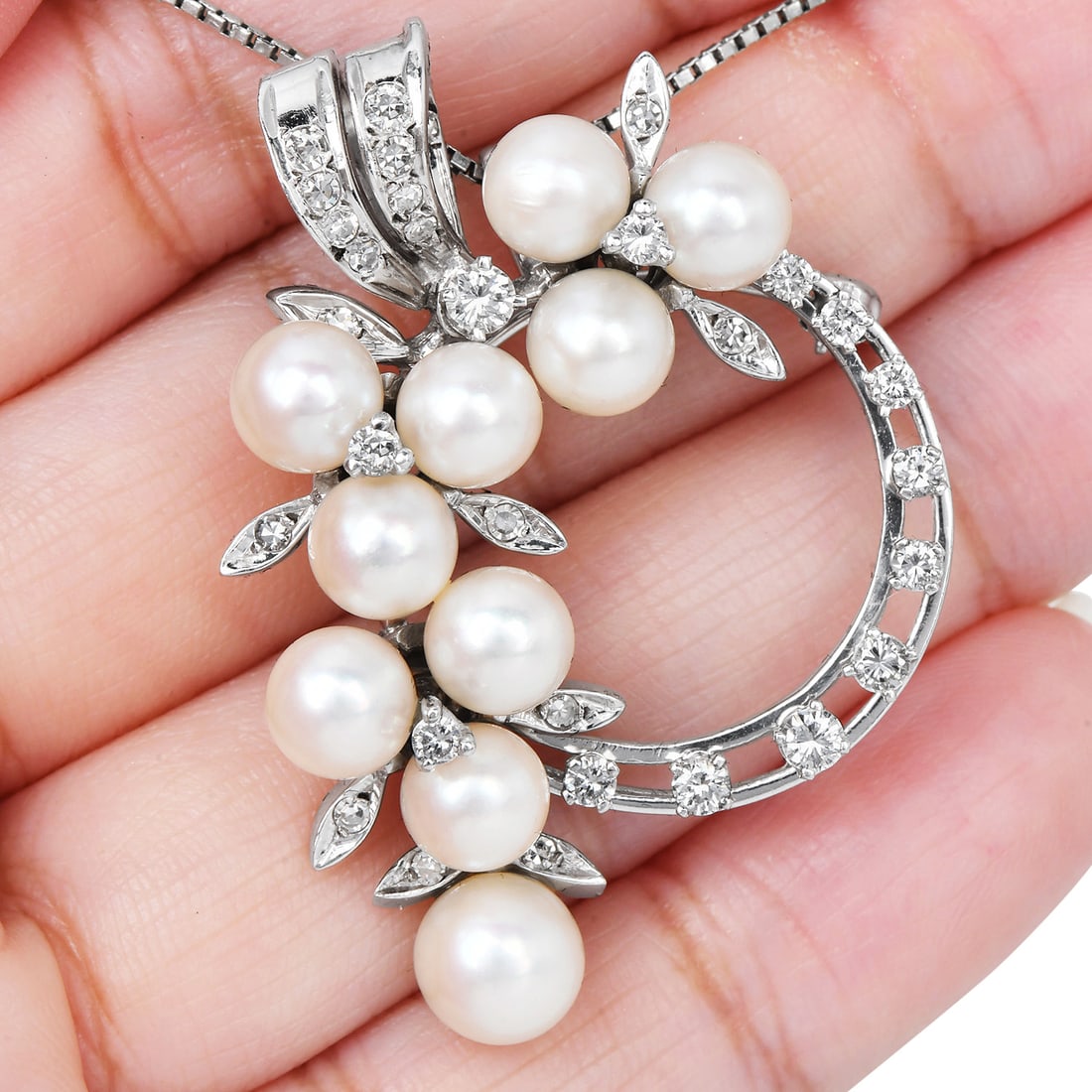 Vintage 1.00ct Diamond Pearl 14K White Gold Circle Floral Brooch Pin 7.9 Grams: Item: Vintage Diamond and Pearl Circle Floral Brooch Pin SKU: ADDJ-03 Metal: 14K White Gold Primary Stones: Cultured Pearls arranged in a floral motif within a c