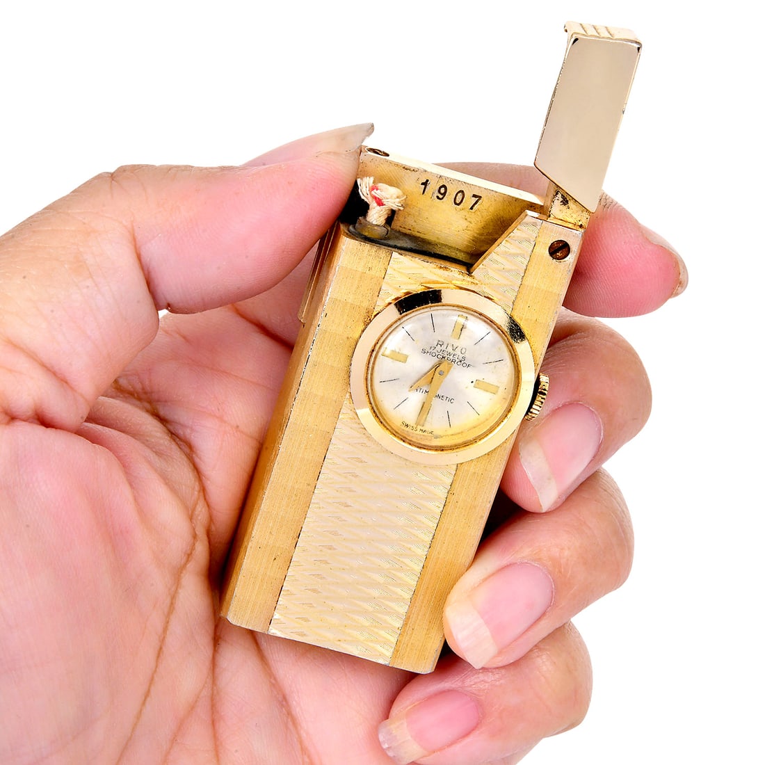 Vintage Rivo Swiss Watch Lighter 54 Grams: Vintage Rivo Swiss Watch Lighter SKU: IJPE-16 Product Description: A fascinating and collectible vintage Rivo Swiss-made watch lighter