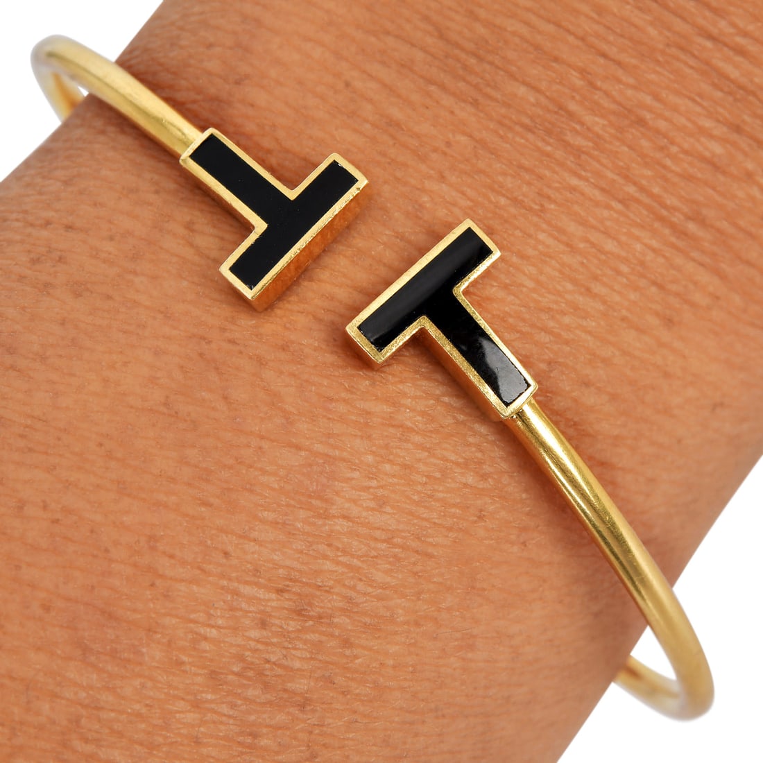 Tiffany & Co. 18K Yellow Gold Onyx T Wire Bracelet Cuff with box 9 2 grams: Tiffany & Co. Onyx T Wire 18K Yellow Gold Bracelet Cuff Brand: Tiffany & Co. Metal: 18K Yellow Gold Wrist Size: Fits approximately 6.75 inches