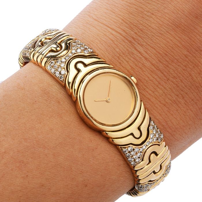 Bvlgari Parentesi 2.50ct Diamond 18K Gold Cuff Bangle Ladies Watch 84.6 Grams: Ladies 18k yellow gold and diamond Parentesi bangle bracelet watch by Bvlgari. This stylis Bulgari ladies watch of unique feminine appeal is adorned on the bangle bracelet with approx 2.50 carats of f