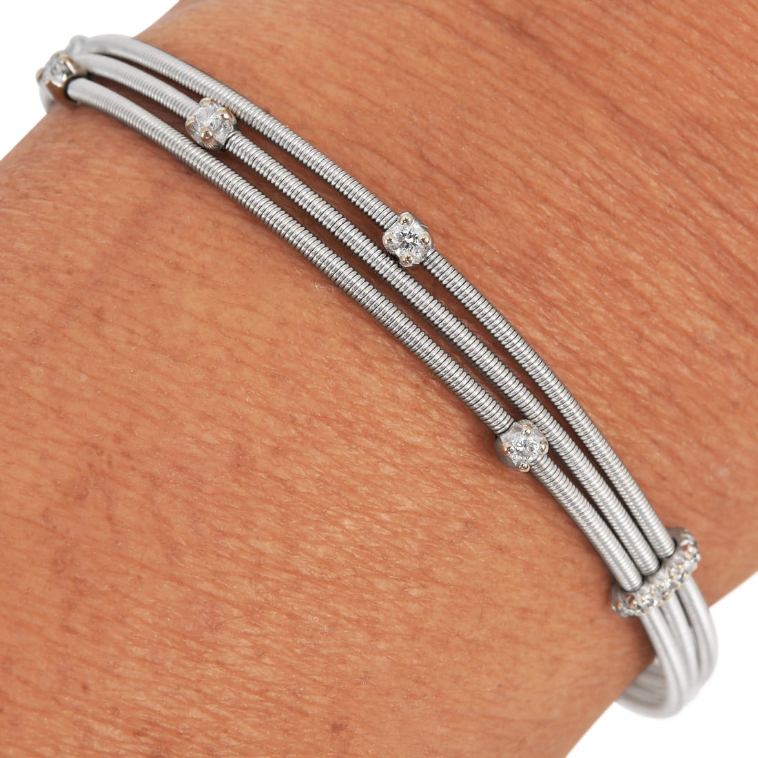 Marco Bicego Marrakech Diamond Triple Strand Bracelet in 18K White Gold fits a 6 3/4 wrist size: Marco Bicego Marrakech Diamond Triple Strand Bracelet Brand: Marco Bicego Collection: Marrakech Metal: 18K White Gold Wrist Size: Fits approximately 6.75 inches Total Weight: Approximately 11.6 grams