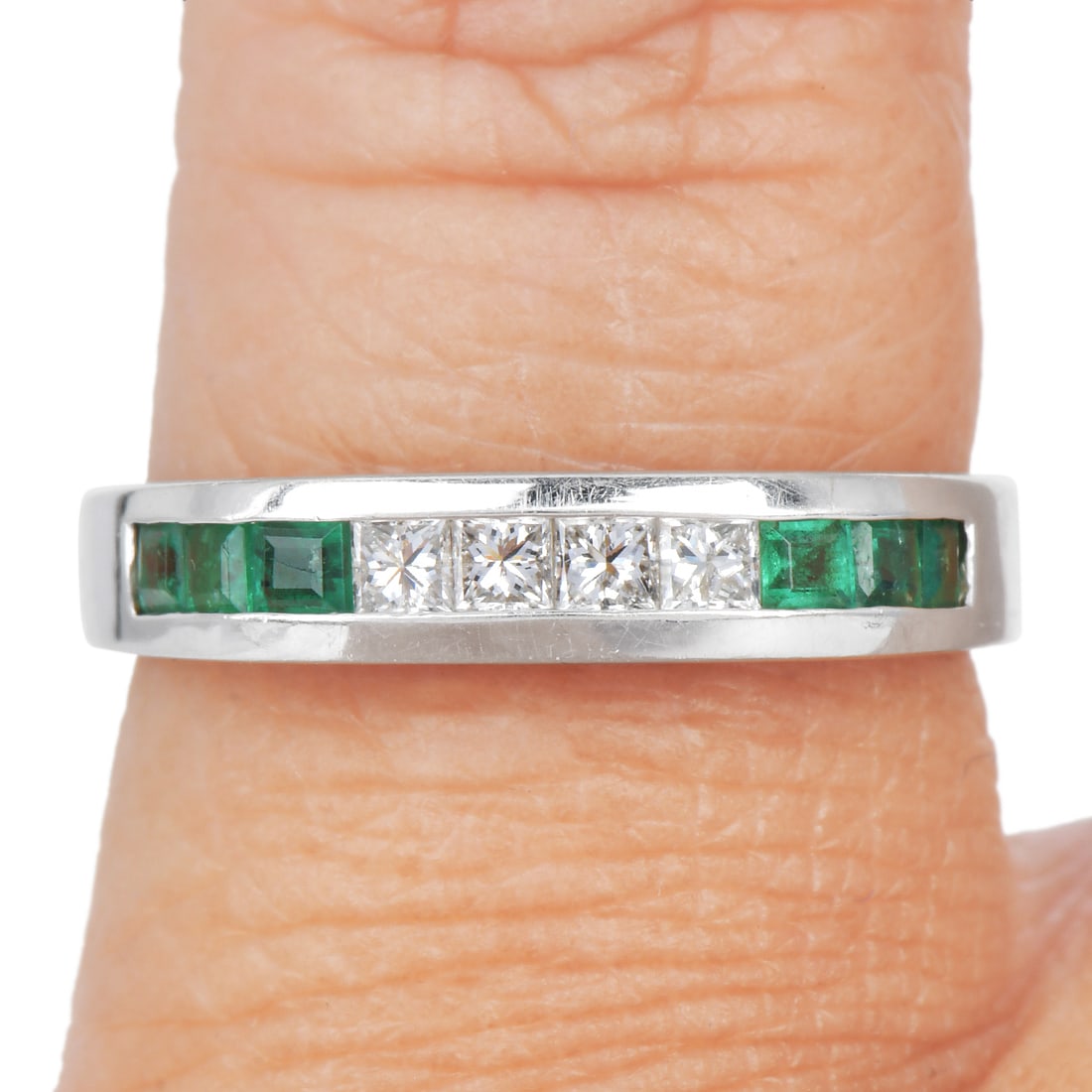 Emerald 0.50ct Diamond 18K White Gold Stackable Band Ring 3.4 Grams: Emerald Diamond 18K White Gold Stackable Band Ring Elegant and versatile, this stackable band ring is crafted in fine 18K white gold and showcases a sophisticated combination of vibrant emeralds and
