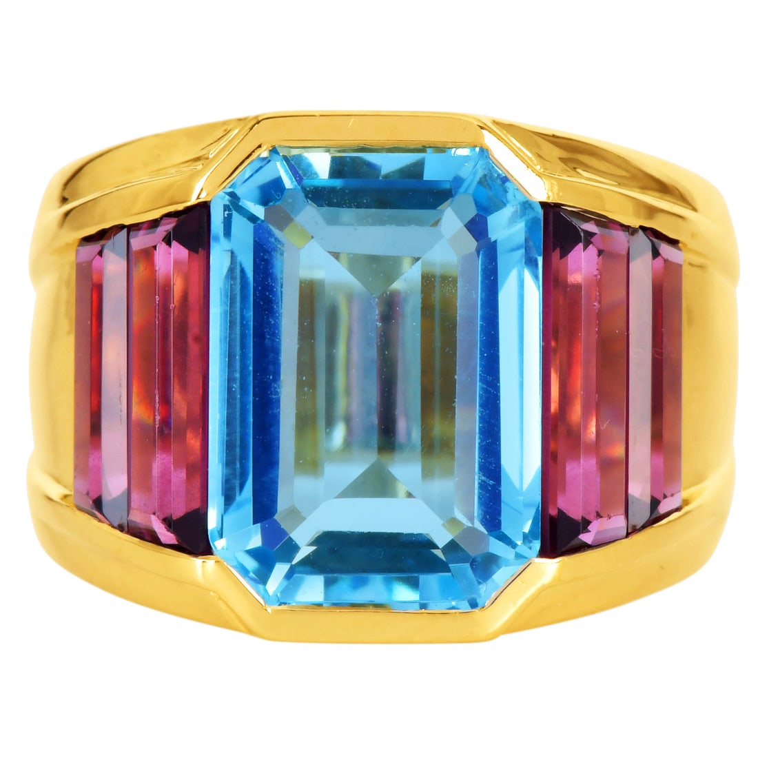 Vintage Blue Topaz 8.50ct Purple Tourmaline 14K Yellow Gold Cocktail Ring 15.3 Grams: Vintage Blue Topaz Tourmaline 14K Yellow Gold Cocktail Ring Metal: 14K Yellow Gold Ring Size: 7 Total Weight: Approximately 15.3 grams Primary Stone: Blue Topaz Cut: Emerald Cut Total Carat Weight: