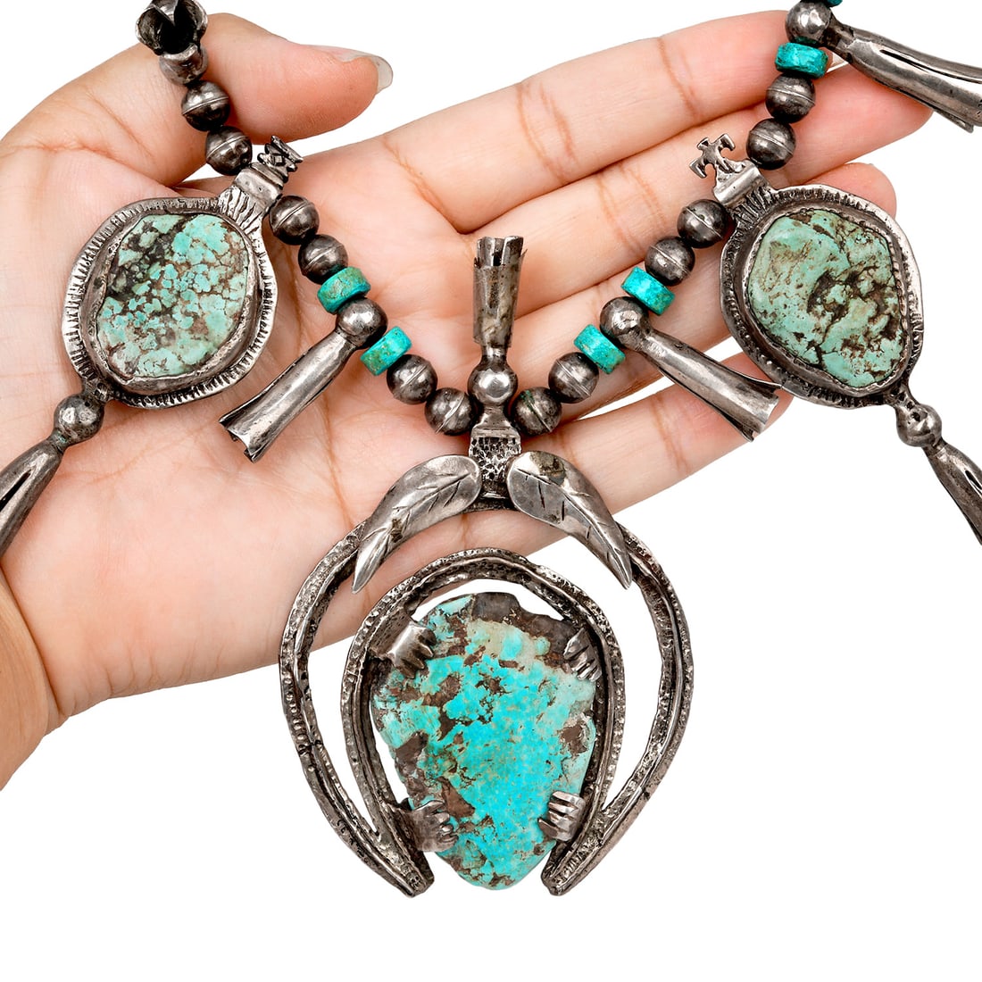 Vintage Turquoise Sterling Silver Squash Blossom Necklace 207.5 Grams: Vintage Turquoise Sterling Silver Squash Blossom Necklace Metal: Sterling Silver Length: Approximately 30 inches Total Weight: Approximately 207.5 grams Primary Stones: Turquoise Design: Squash