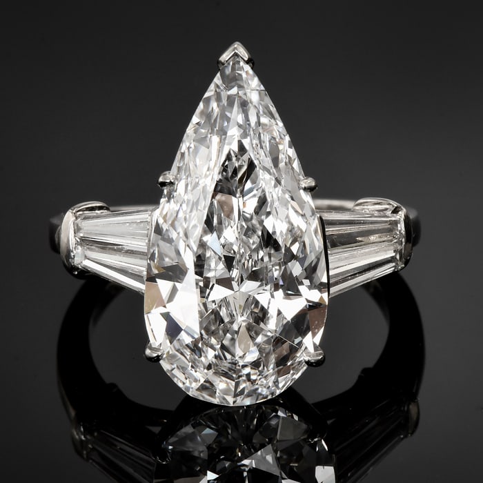 GIA Elongated 6.16ct D color Diamond Pear Shape Platinum Engagement Ring: This exquisite diamond engagement ring is centered by one elongated pear shape diamond of approx. 6.16cttw. GIA graded the diamond, with the highest color grade, D color, and an excellent clarity grad