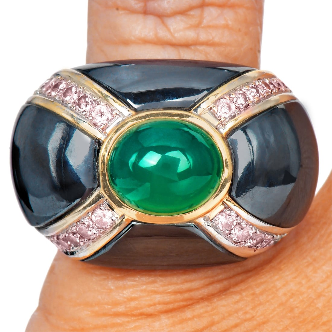 Green Chalcedony Pink Diamond Hematite 18K Yellow Gold Ring 17.6 Grams: A bold and sculptural statement ring crafted in 18K yellow gold, centered with a luminous green chalcedony cabochon. The dramatic design is accented by carved hematite panels that create a striking co