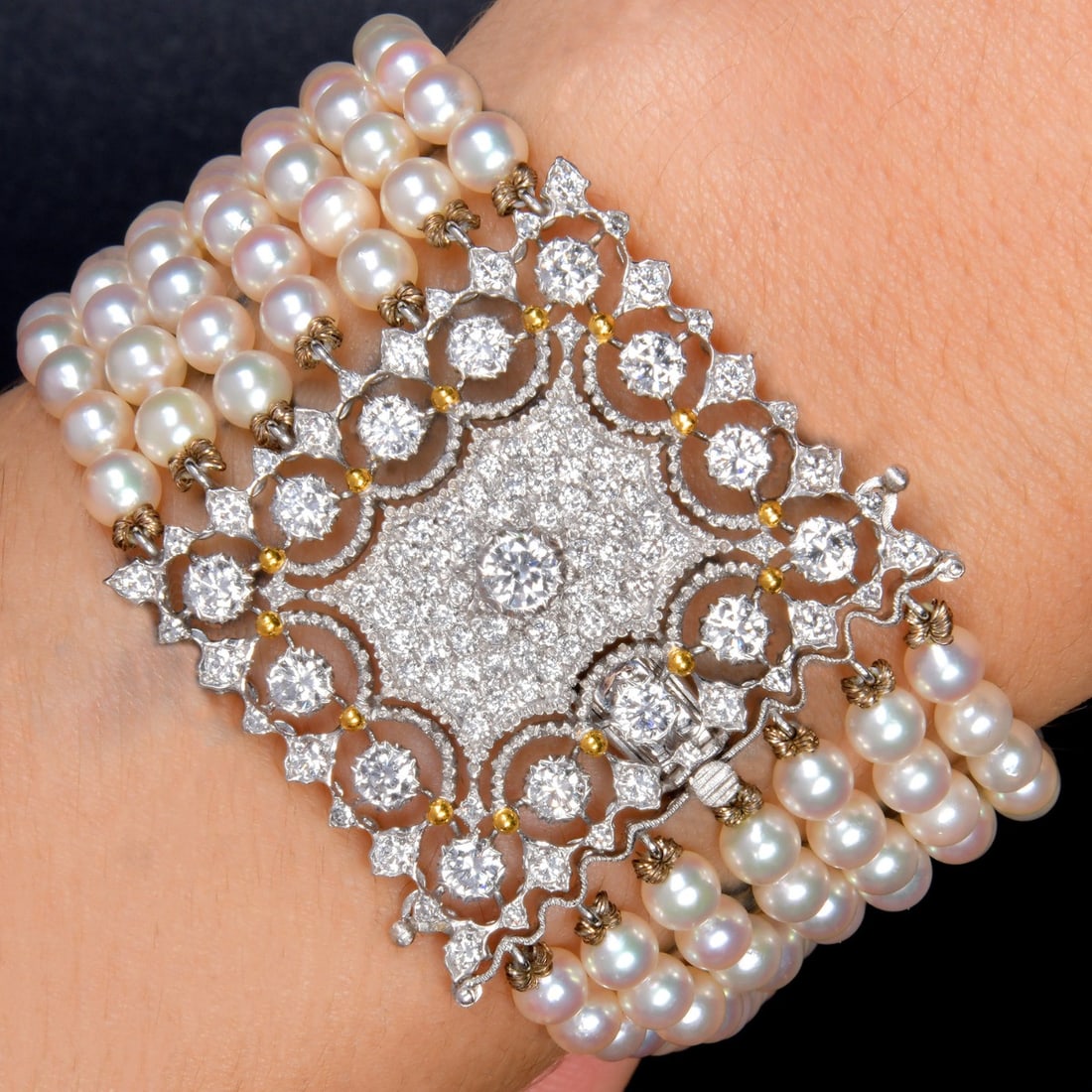 Vintage Buccellati 2.48ct Diamond Pearl 18K White & Yellow Gold 7-Strand Bracelet 35.6 Grams: Product Description: This exquisite vintage Buccellati bracelet showcases the renowned Italian maison's unmistakable artistry and refined design. Meticulously crafted in 18K white and yellow gold, the