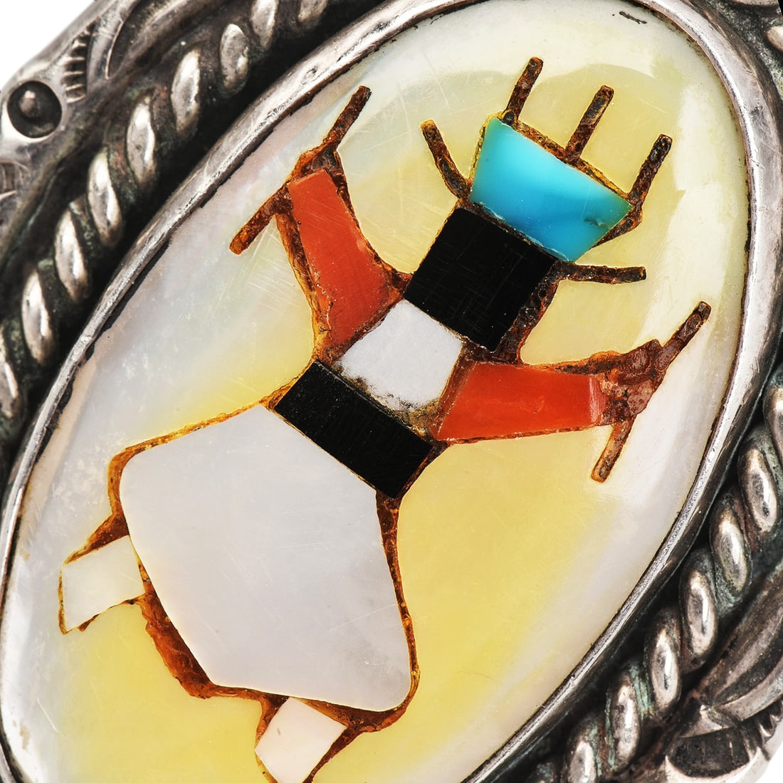 Vintage Navajo Roland Hogan Begay Multi stone Inlay Gaan Dancer Sterling Silver Ring: Vintage Navajo Roland Hogan Begay Multistone Inlay Gaan Dancer Sterling Silver Ring DESCRIPTION: Striking vintage Navajo ring by silversmith Roland Hogan Begay, featuring a detailed Gaan Dancer design