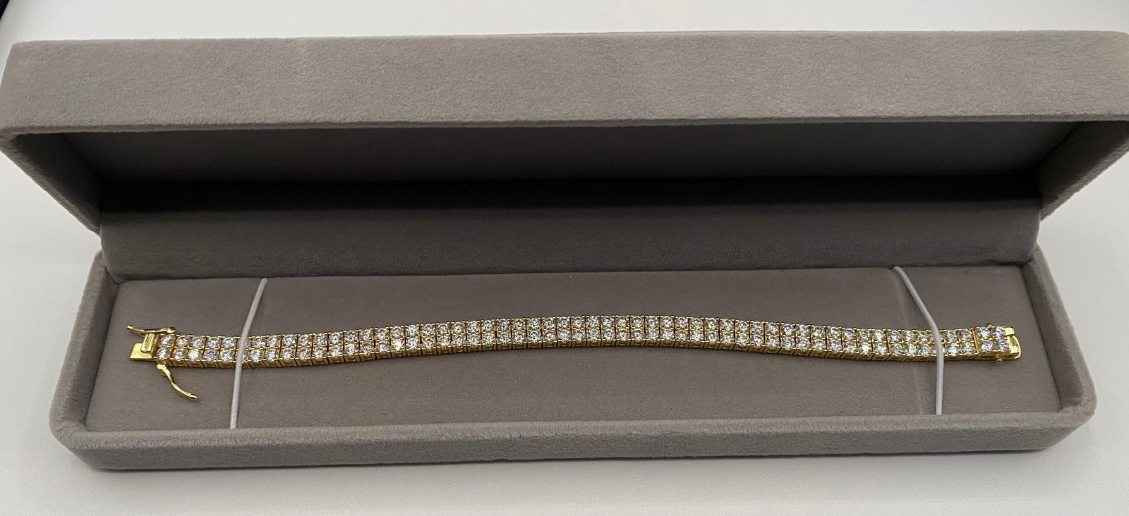 Double Tennis VVS Bracelet: 18k Yellow Gold Plated On Sterling Silver Bracelet. bracelet Lenght: 7 Inches Color: D, clarity VVS1 and near flawless.Stone tests positive for diamond with a diamond tester and exhibits more fire