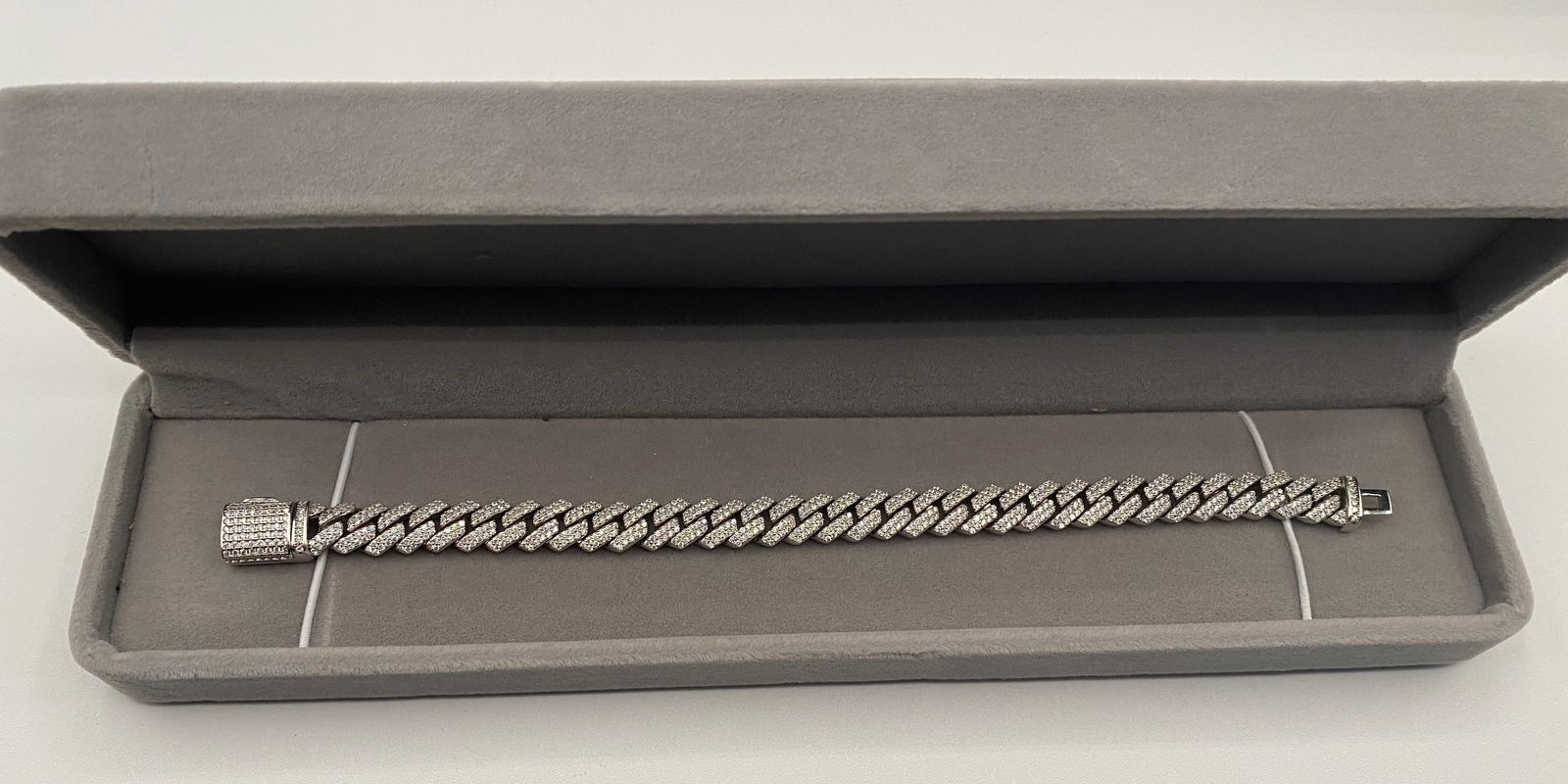 Cuban Moissanite VVS Bracelet: 18k White Gold Plated On Sterling Silver Bracelet. bracelet Lenght: 7 Inches Color: D, clarity VVS1 and near flawless.Stone tests positive for diamond with a diamond tester and exhibits more fire and