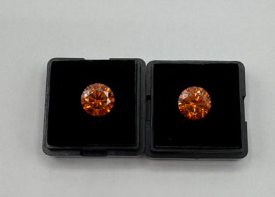 Two Orange Moissanite Stones
