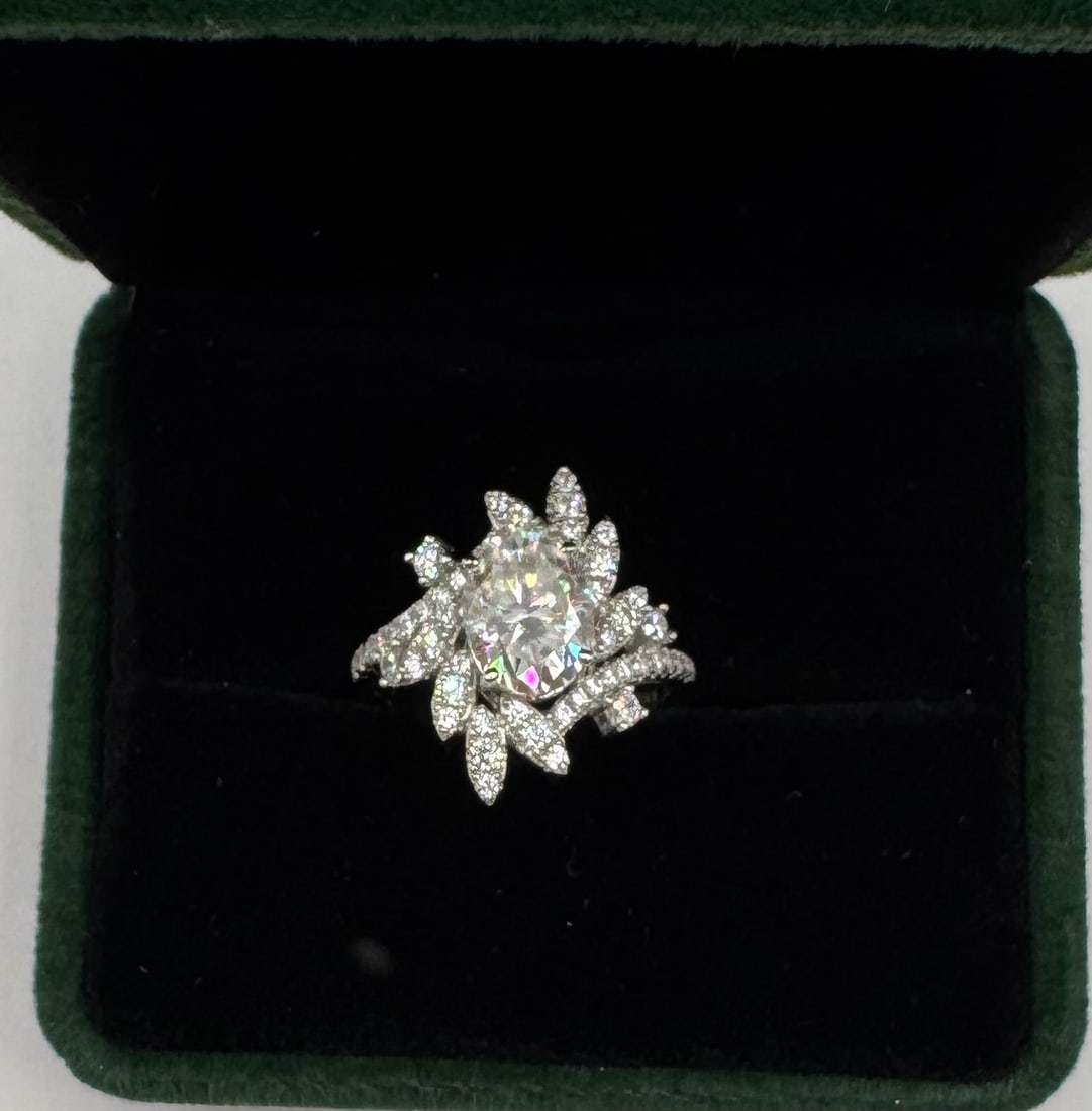 Sparkling VVS Moissanite Ring: 18k White Gold Plated On sterling Silver Moissanite VVS1 Stone Ring Color: D Stone Size: 2 Carats Ring Size: 7 Certificate: GRA