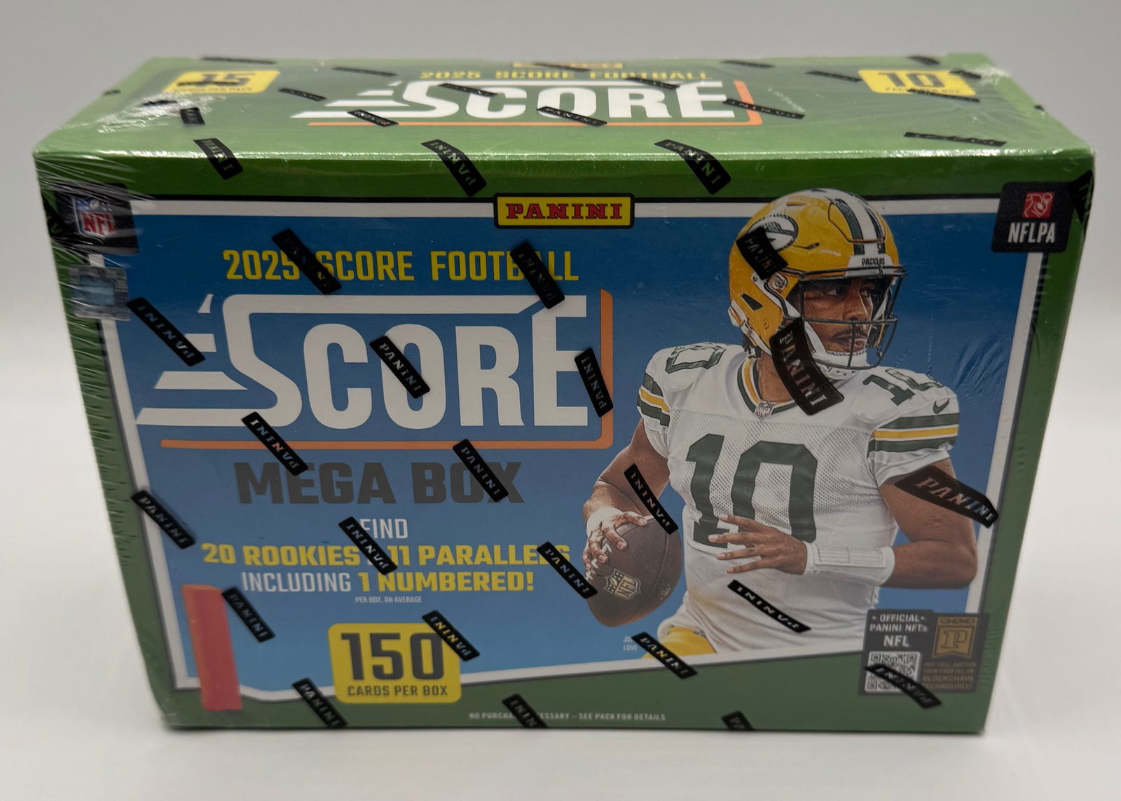 2025 Panini Score NFL Football Sealed Mega Box: A massive 2025 Panini Score Football Mega Box featuring Jordan Love. Score is known for having a deep checklist including many rookie players.• Total Cards: 150 cards per box.• Inserts: Guar