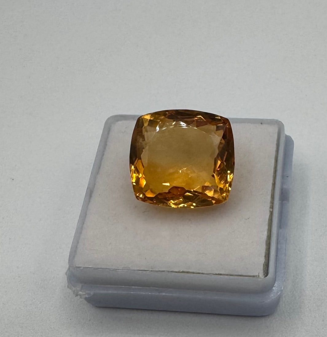 Impressive 12.00 Ct Cushion Cut Golden Citrine Loose Gemstone: Offered is a magnificent 12.00-carat natural citrine gemstone. This stone features a vibrant, saturated golden-yellow hue, often referred to as "Madera" or "Honey" citrine. It is expertly faceted into