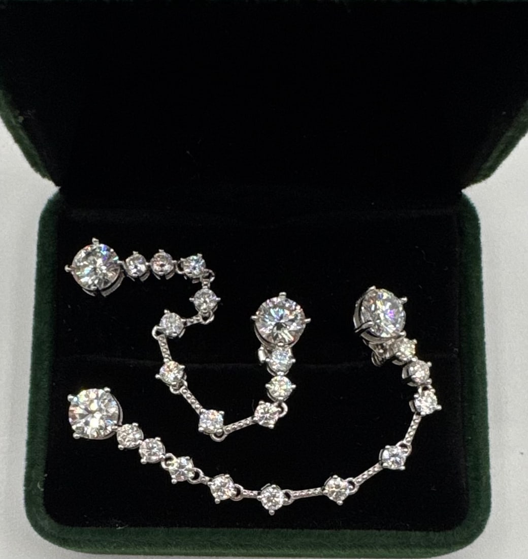 6.40 CTW Moissanite Graduated Dangle Drop Earrings in Sterling Silver: Design: Elegant articulated long-drop "linear" style earrings featuring a graduated sequence of round brilliant-cut moissanites.• Total Carat Weight: Approximately 6.40 CTW (3.20 carats per earri