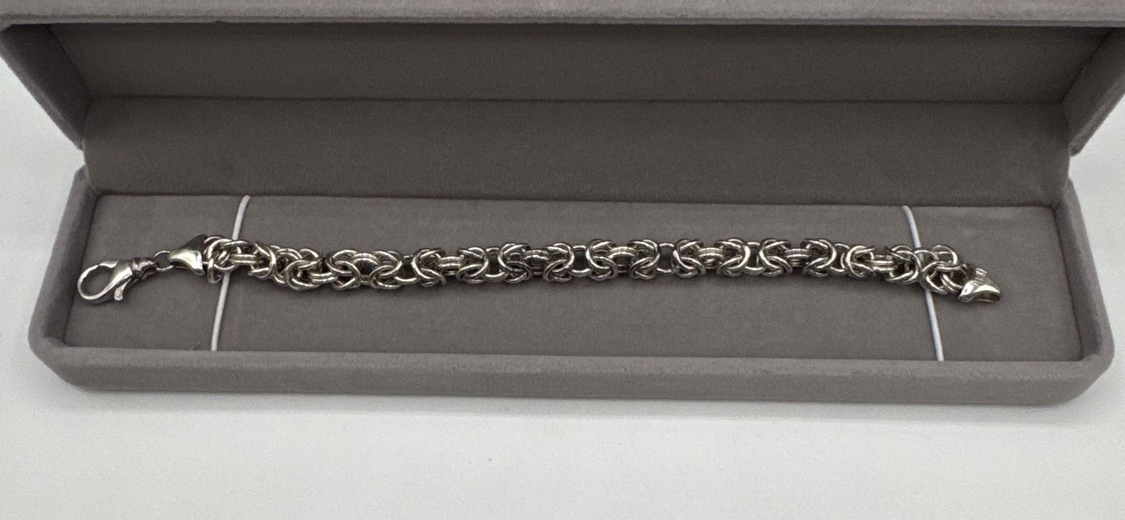 Sterling Silver 8" Byzantine Link Chain Bracelet: Material: .925 Sterling SilverStyle: Byzantine (Birdcage) LinkLength: 8 InchesClosure: Secure Lobster Claw ClaspCondition: Excellent estate condition with a bright, polished finish. The weave is tight